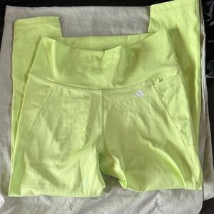 Adidas Women's Lime Green Athletic leggings. Almost to the ankle length.